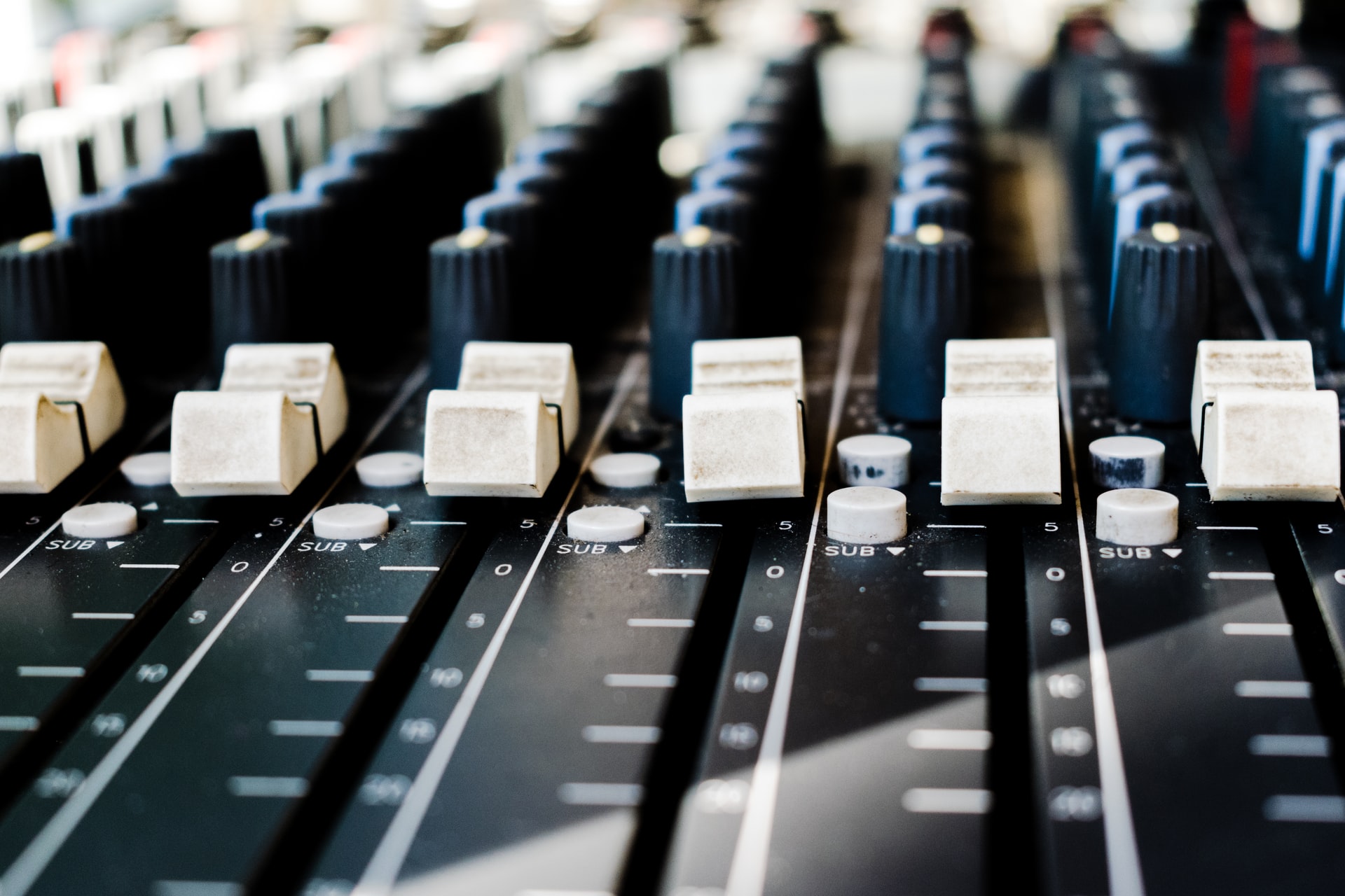 Faders on a mixing board
